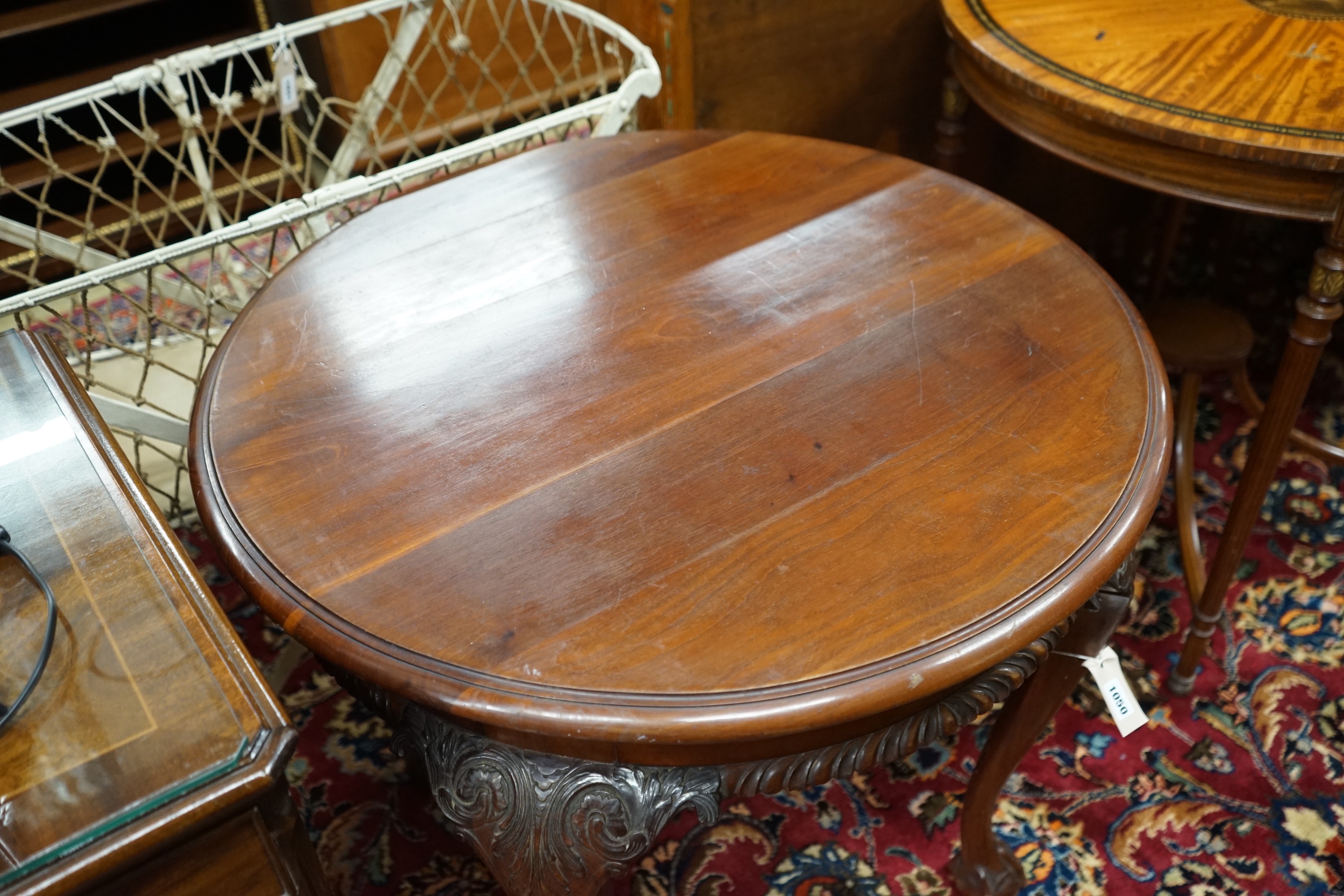 An early 20th century Chippendale revival circular mahogany centre table, diameter 73cm, height 70cm